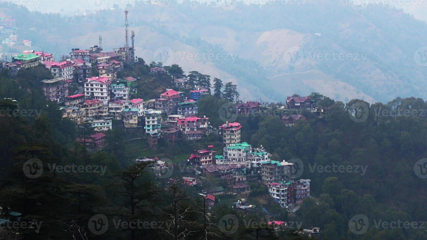 A hilly landscape full of residential complexes in Himachal Pradesh, India photo