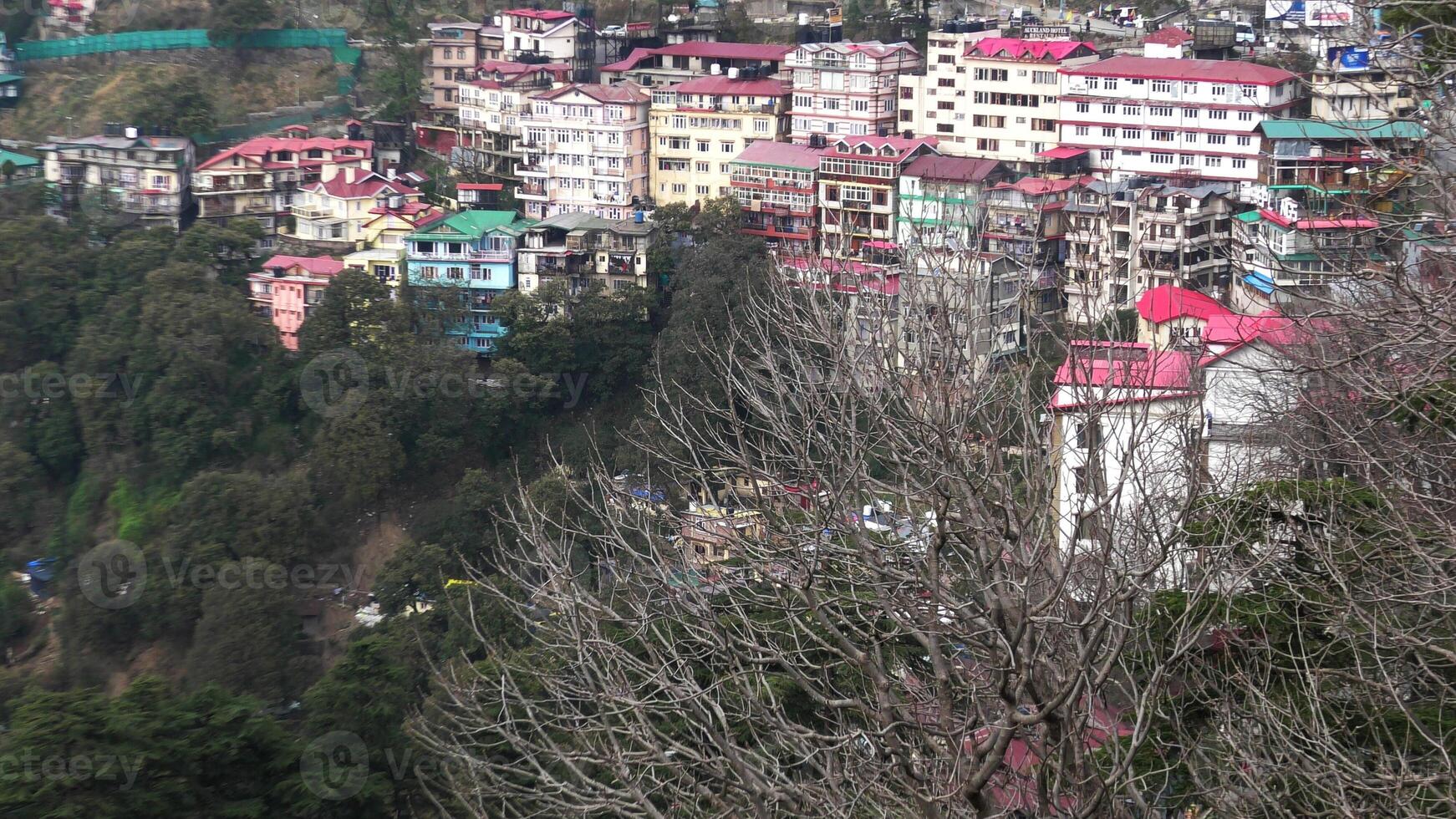 A hilly landscape full of residential complexes in Himachal Pradesh, India photo