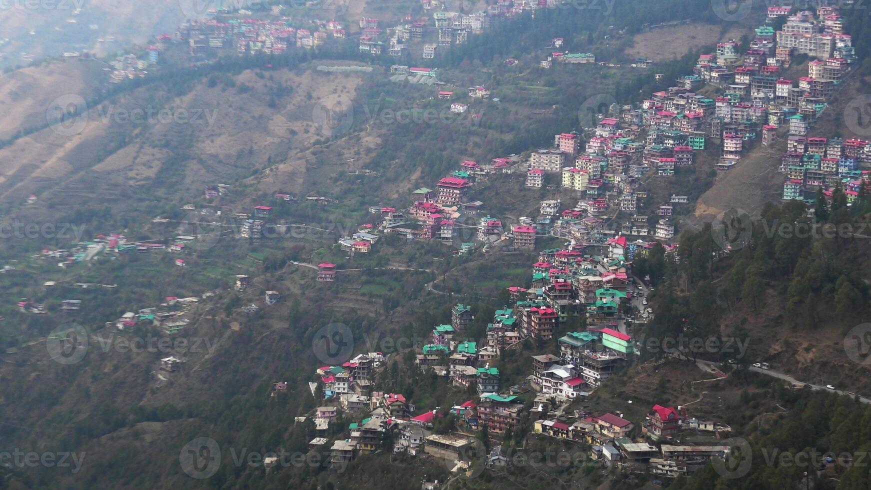 A hilly landscape full of residential complexes in Himachal Pradesh, India photo
