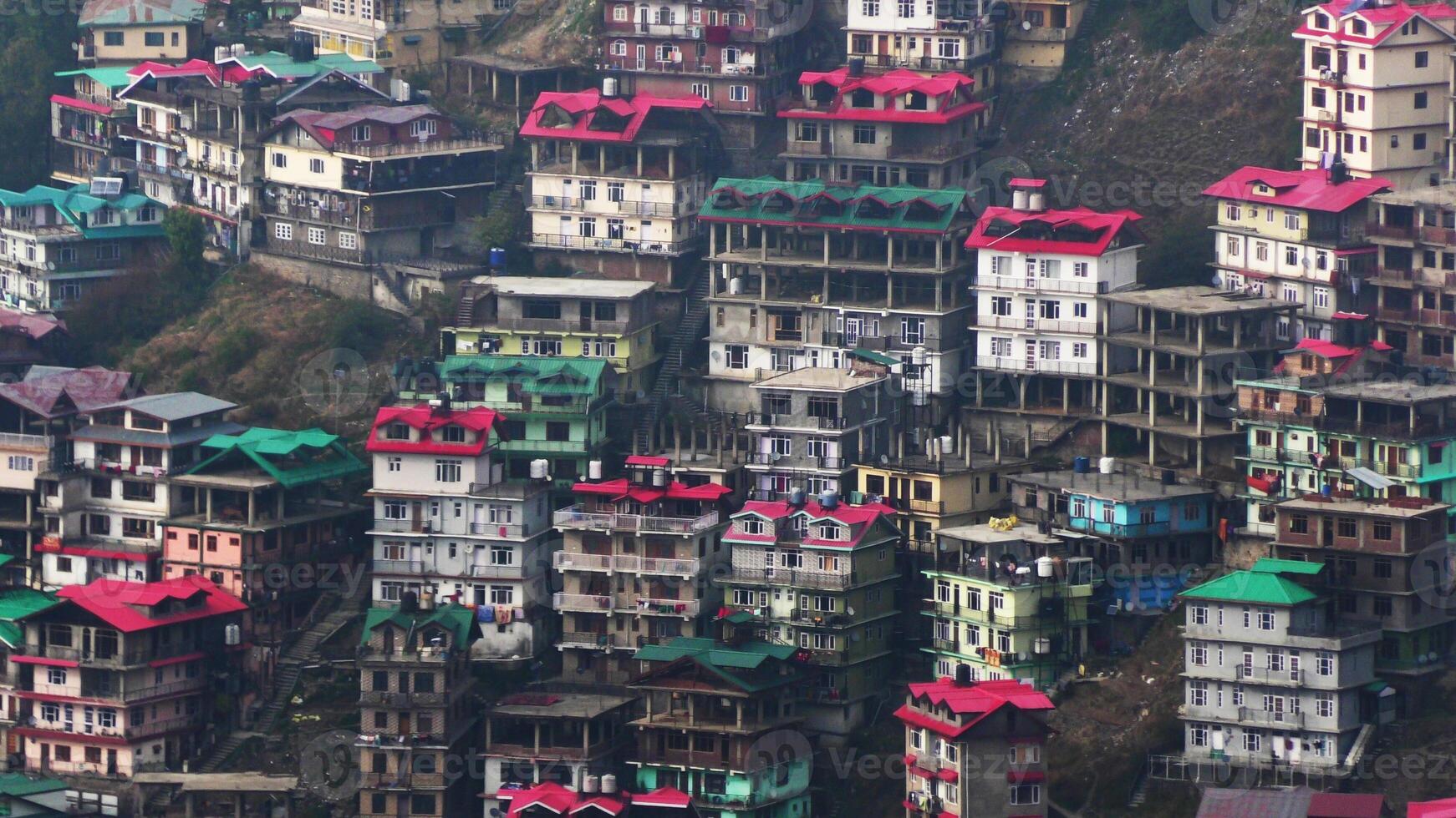 A hilly landscape full of residential complexes in Himachal Pradesh, India photo