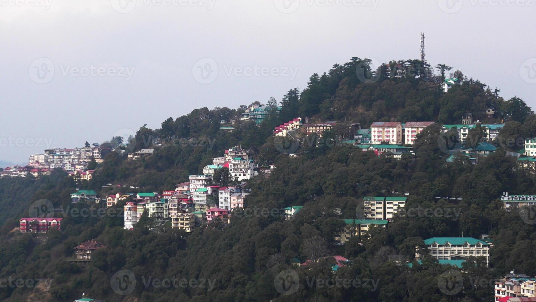 A hilly landscape full of residential complexes in Himachal Pradesh, India photo