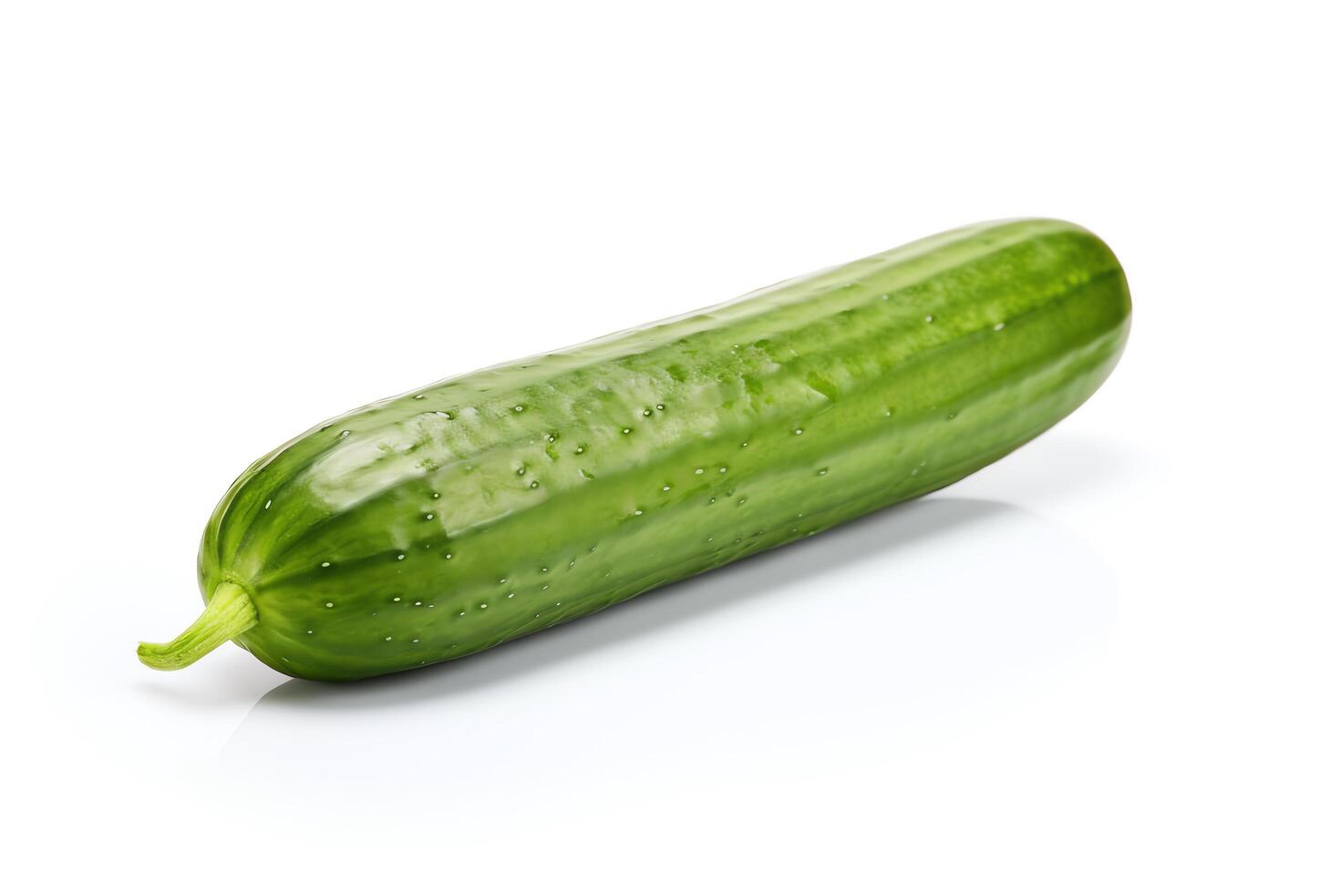 A long, green cucumber isolated on a white background. photo
