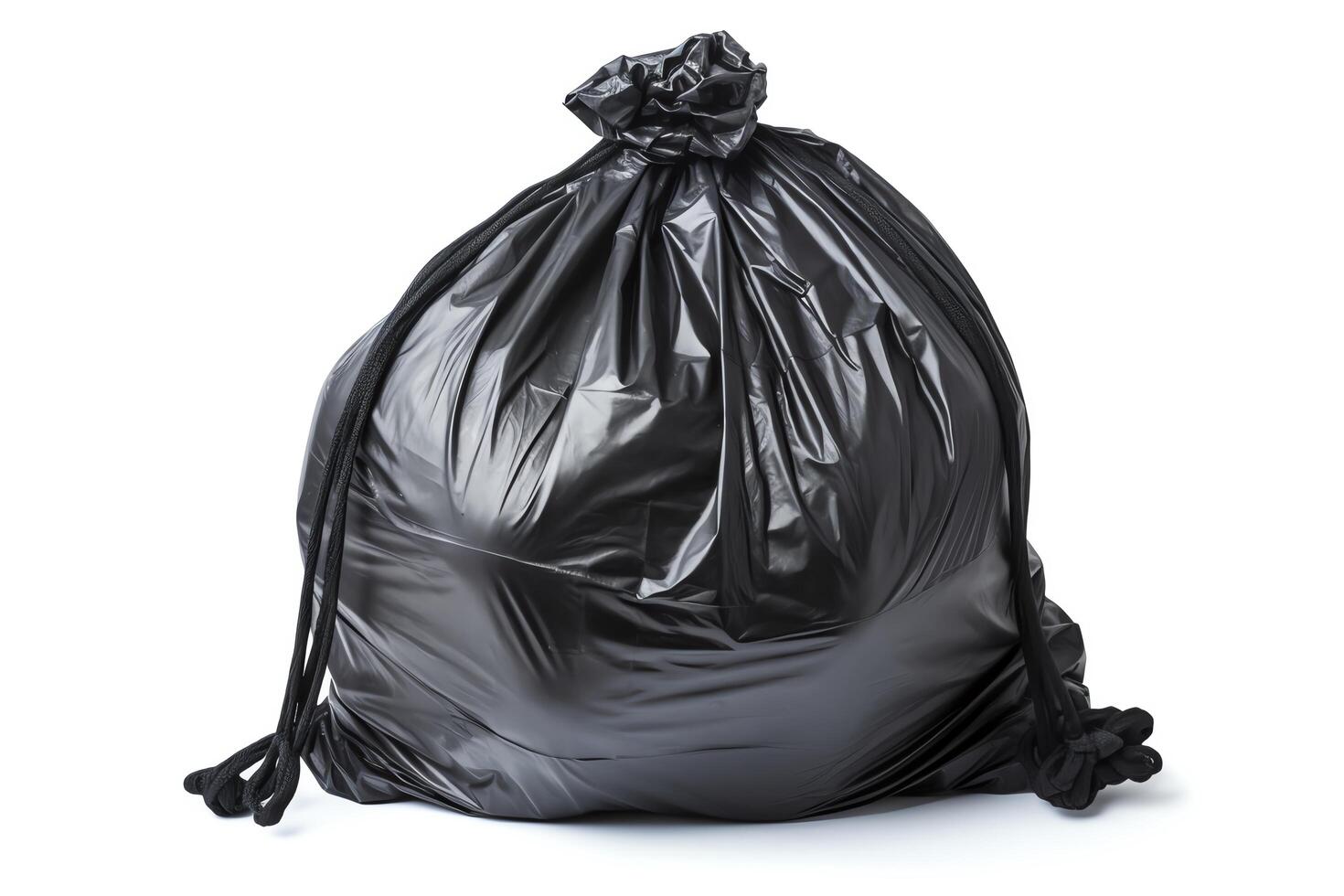 Black garbage bag isolated on white background. photo