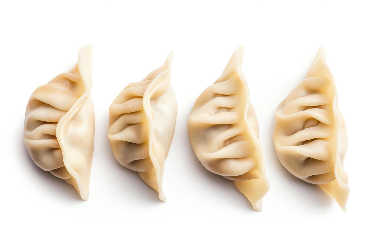 A row of four dumplings isolated on a white background photo