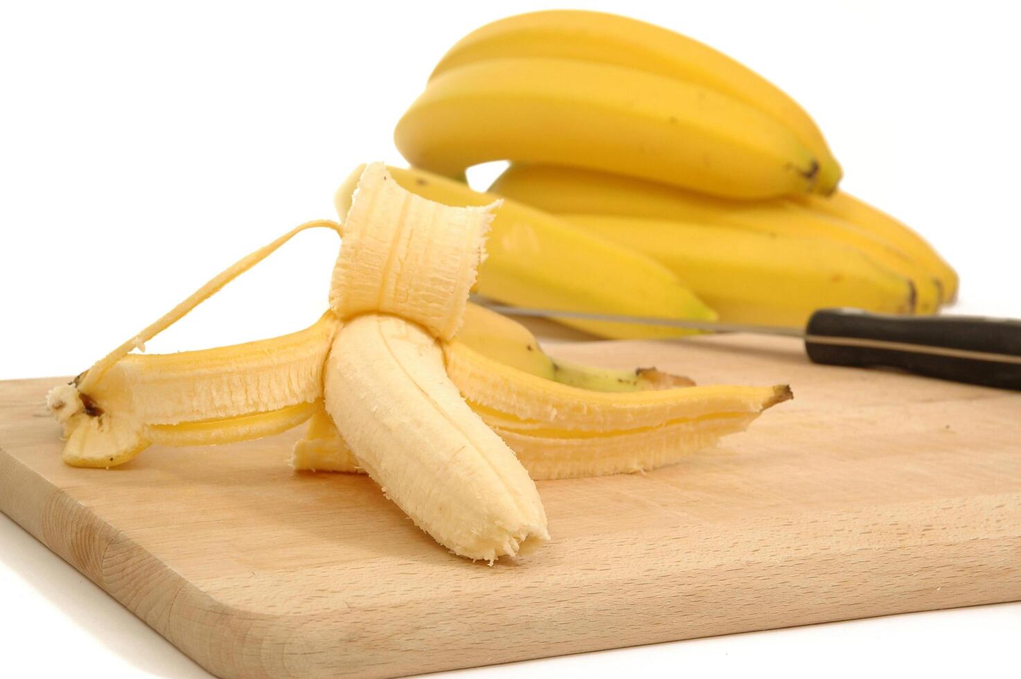 Bananas on a carving board photo