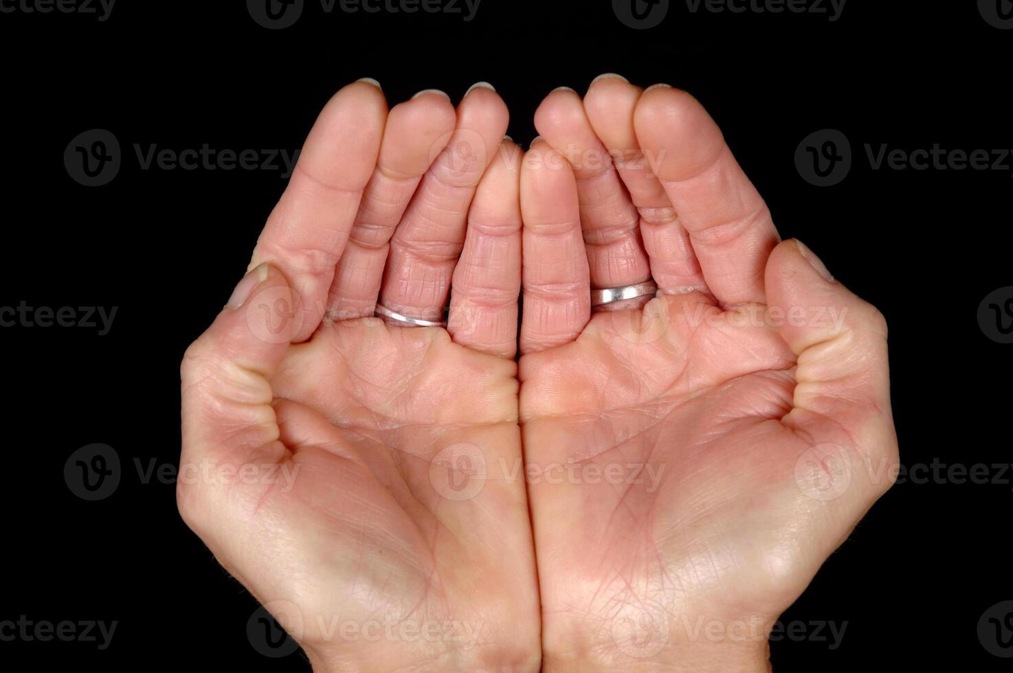 Open hands on black background photo