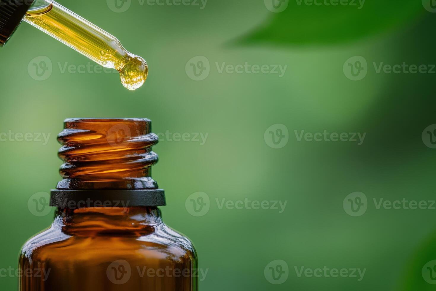 An elegant amber glass bottle stands alone, featuring a dropper delicately releasing golden oil. The vibrant green backdrop enhances its tranquil aura, inviting a sense of calm and natural beauty. photo