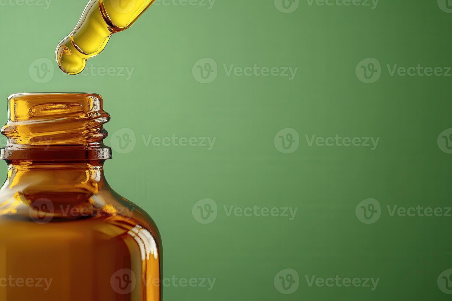 An elegant amber glass bottle stands isolated, with a dropper poised above. A golden drop of oil hangs delicately, ready to fall, capturing the essence of natural beauty and simplicity. photo