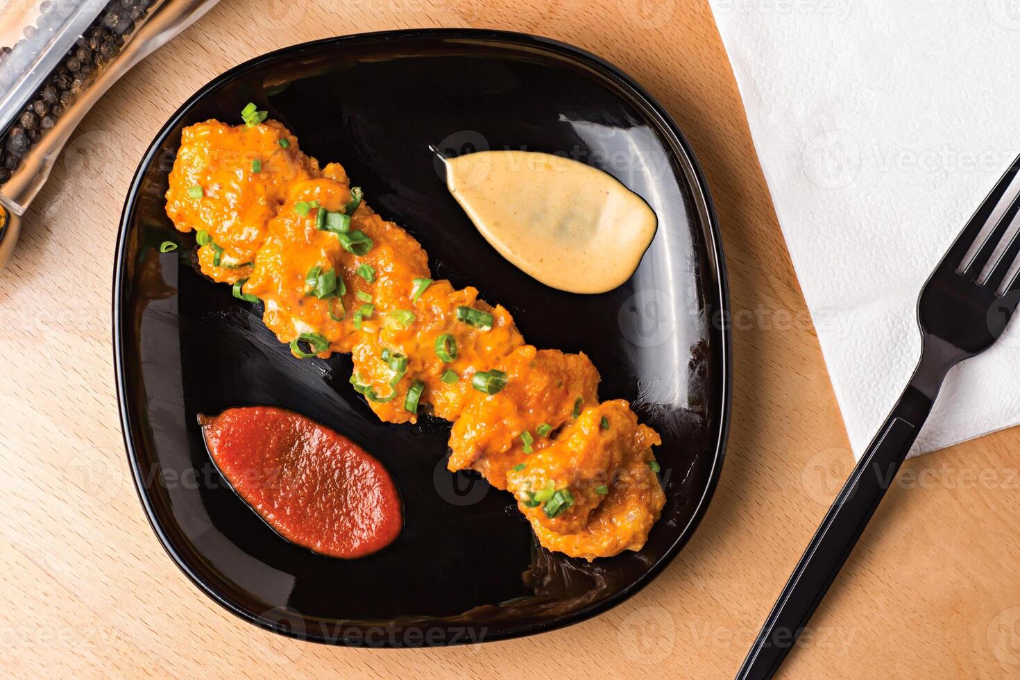 Dynamite Shrimp with Dipping Sauces served in plate isolated on wooden table top view fast food snacks photo