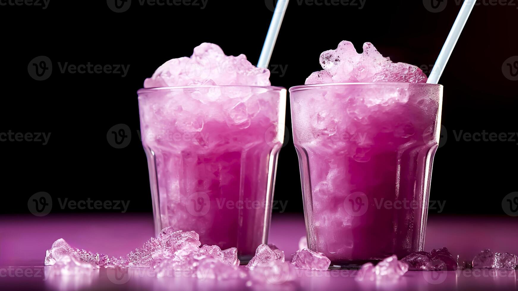Two glasses of pink drink with ice cubes photo