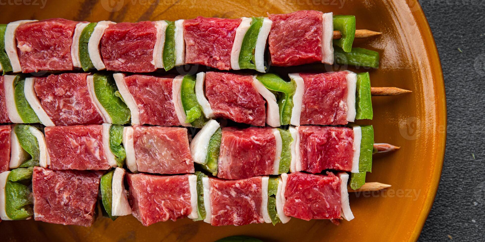 raw kebab meat and vegetables pork, lard, pepper, vegetable dish fresh delicious gourmet food background on the table rustic food top view copy space photo