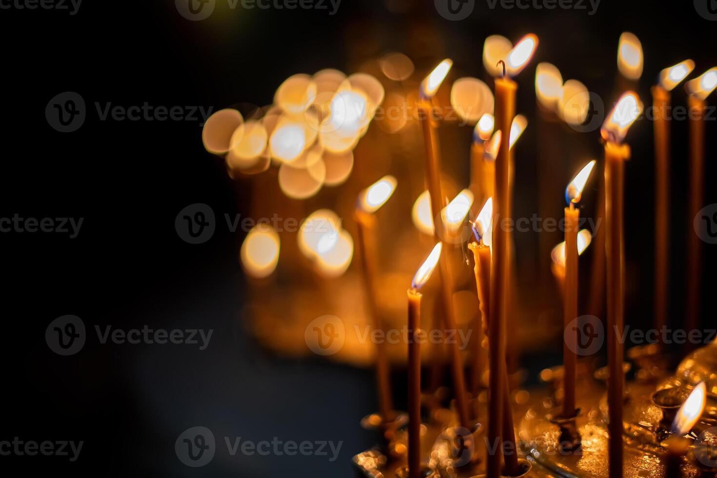 Smoke from the extinct candles. Chandelier with candles in the Church. Background for photobooks about baptism. photo