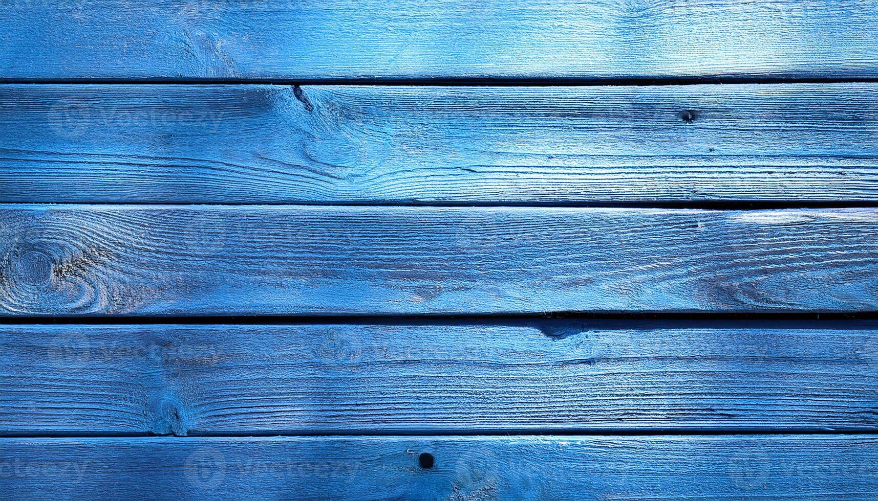 A blue wooden wall with a blue background photo