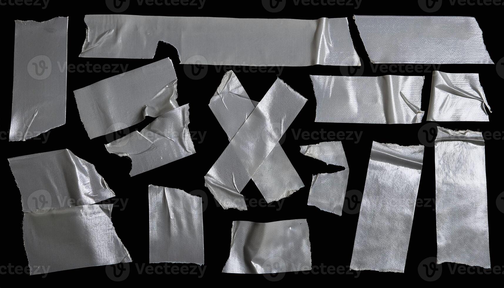 A collection of silver duct tape on a black background photo