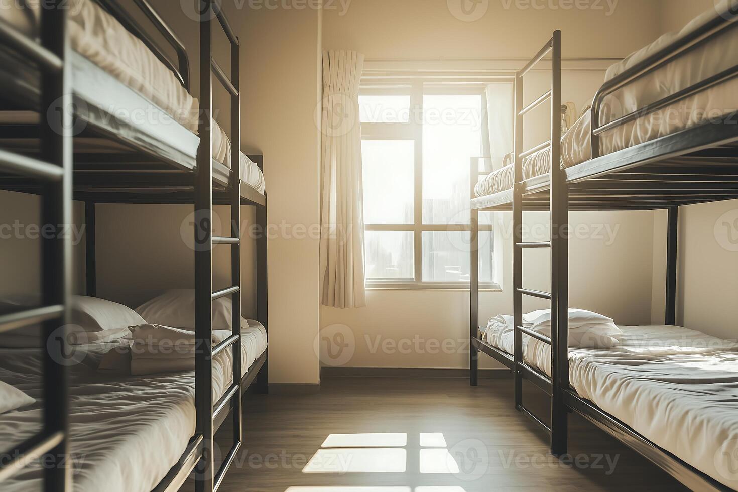 row of bunk beds in a room with a window that allows sunlight photo