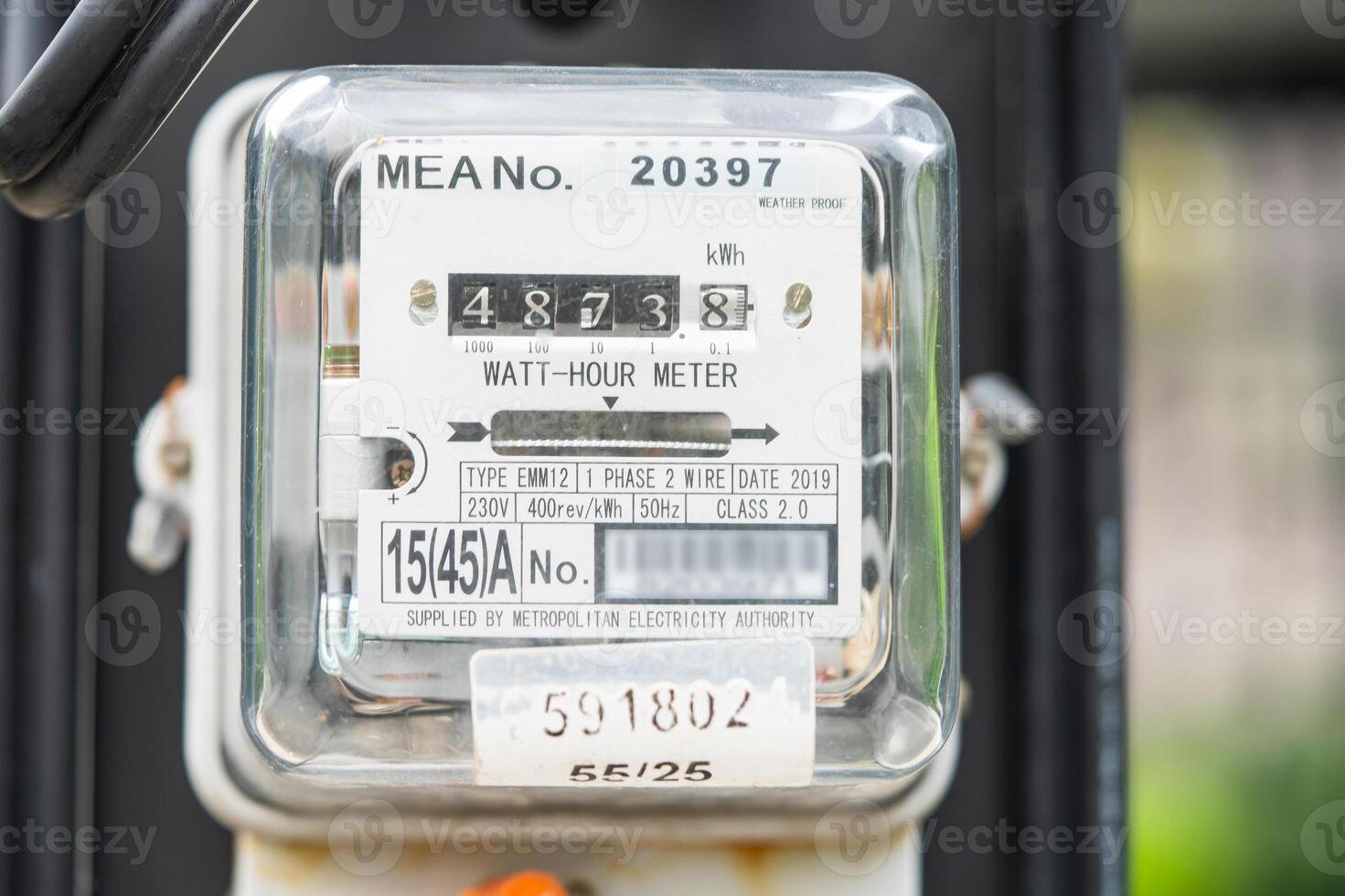 Electric measuring power meter for energy cost at home and office. photo