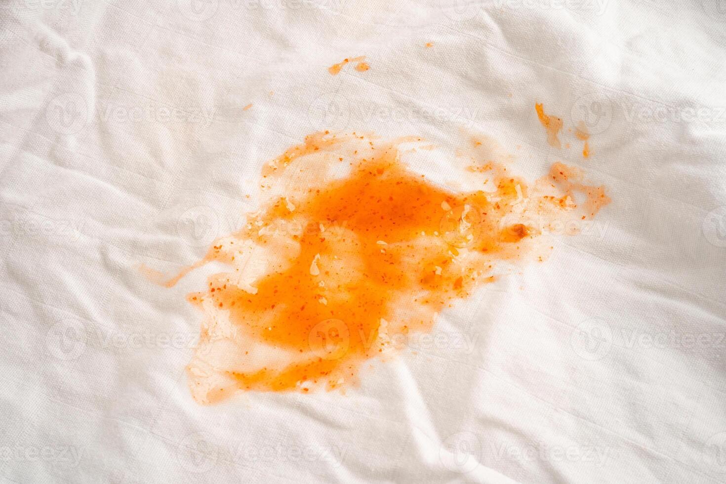 Dirty tomato sauce stain or ketchup on cloth to wash with washing powder, cleaning housework. photo