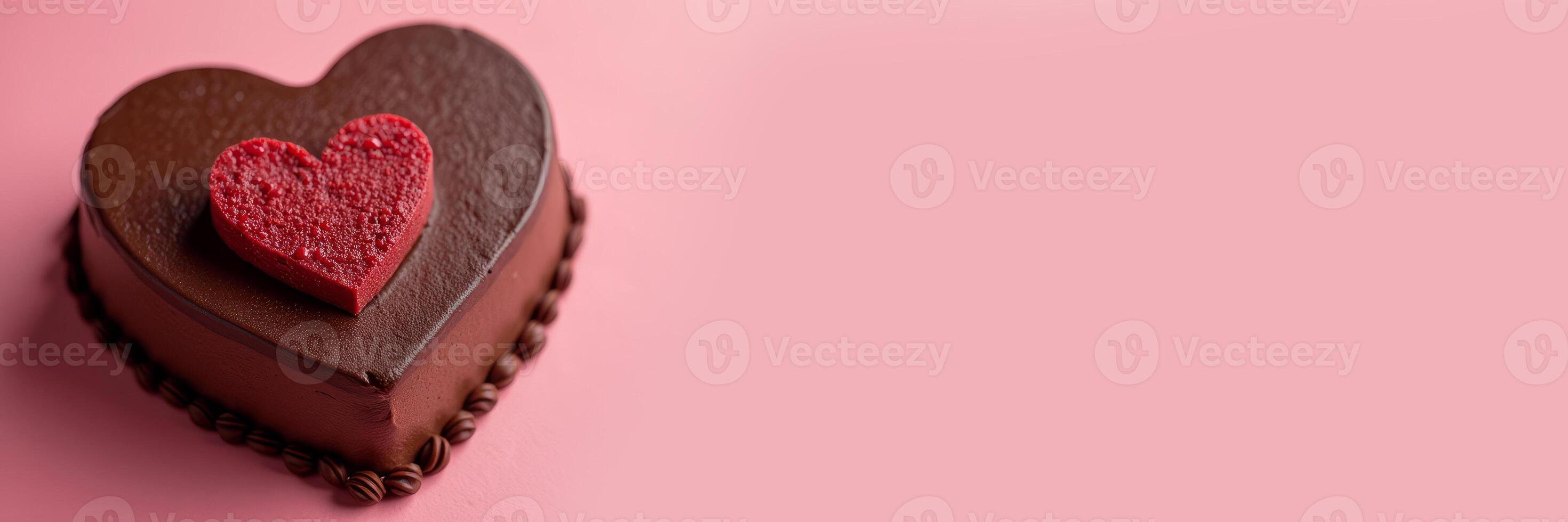 Heart-shaped chocolate mousse cake for Valentine's Day on a pink monotone background. Banner with copy space. photo