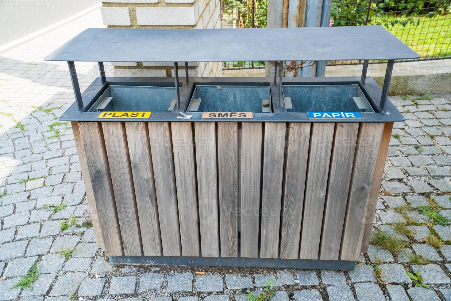 Three metal containers for different garbage. Separation and sorting of rubbish photo
