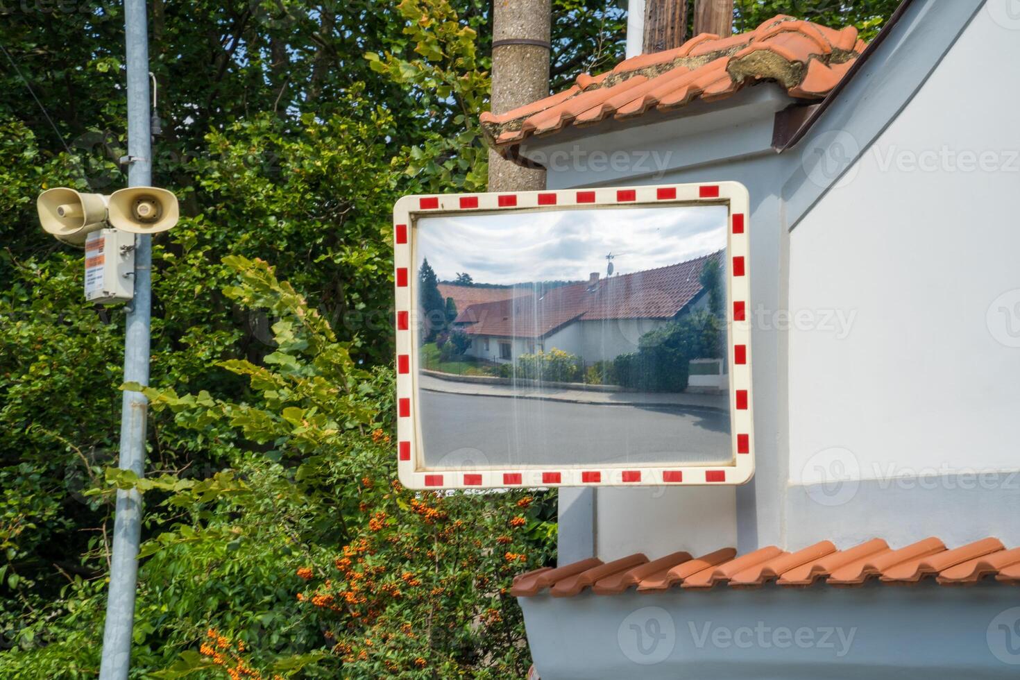 Mirror of spherical type reflecting the cross for improving visibility. Czech photo