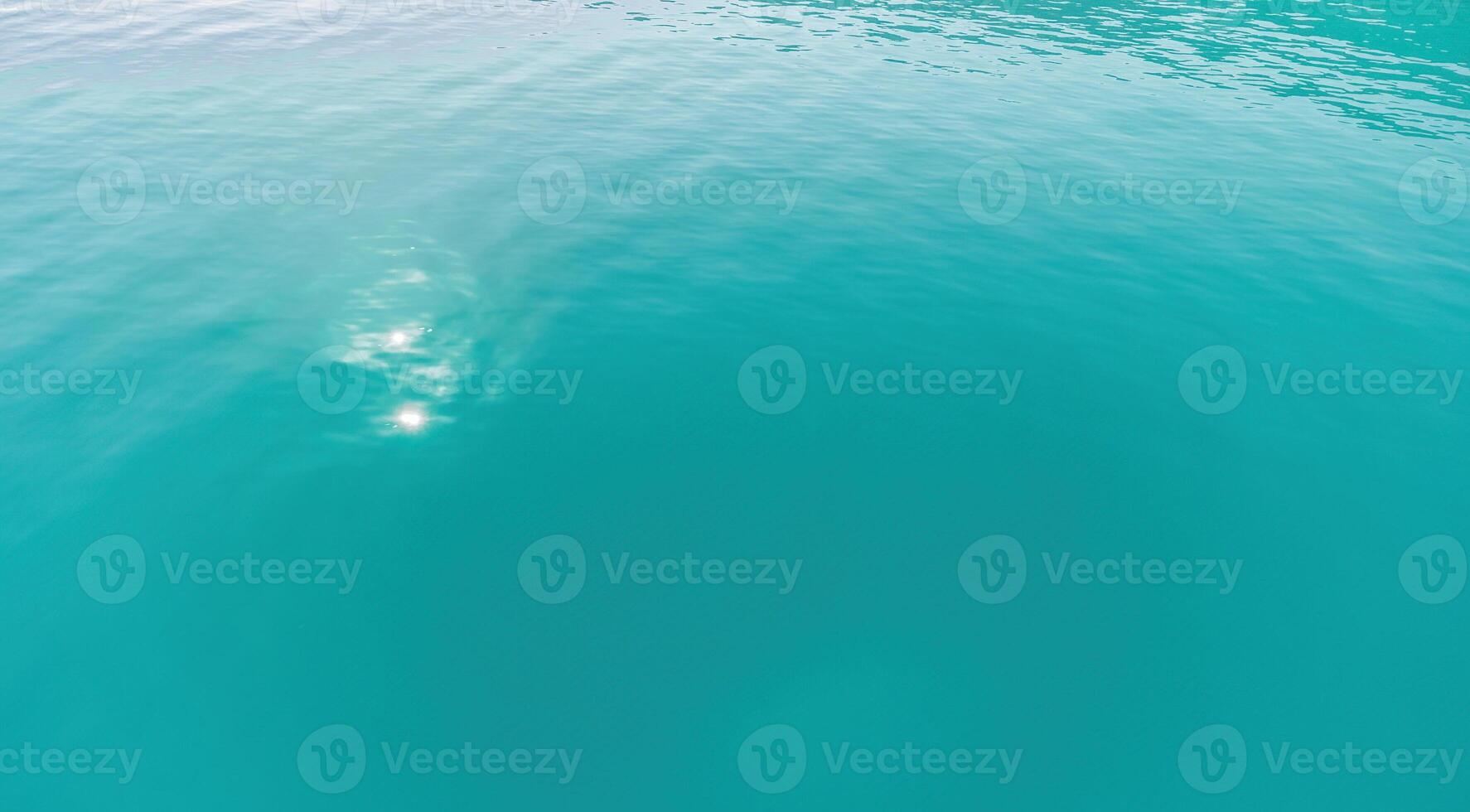 Aerial panoramic view of seascape with crystal clear azure sea and rocky shores. Yachts in a beautiful lagoon on backdrop of rocks. The concept of an ideal destination for summer travel and vacation. photo