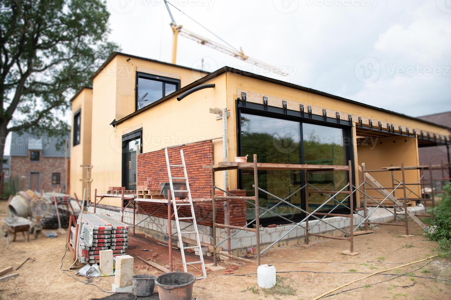building a house supporting structure for laying bricks around a wooden base, a new House is being built, building materials, High quality photo