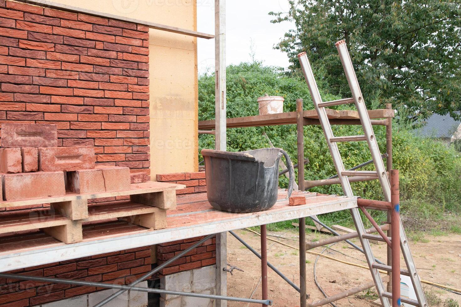 building a house supporting structure for laying bricks around a wooden base, a new House is being built, building materials, High quality photo