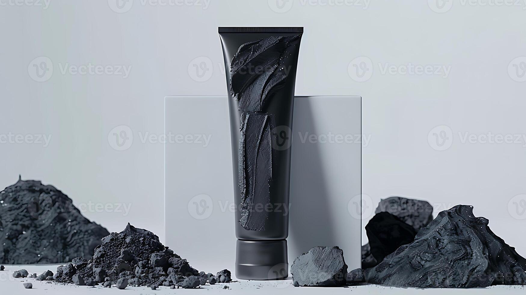 activated charcoal face scrub tube with activated charcoal pieces on white background for skincare routine and beauty regimen. photo