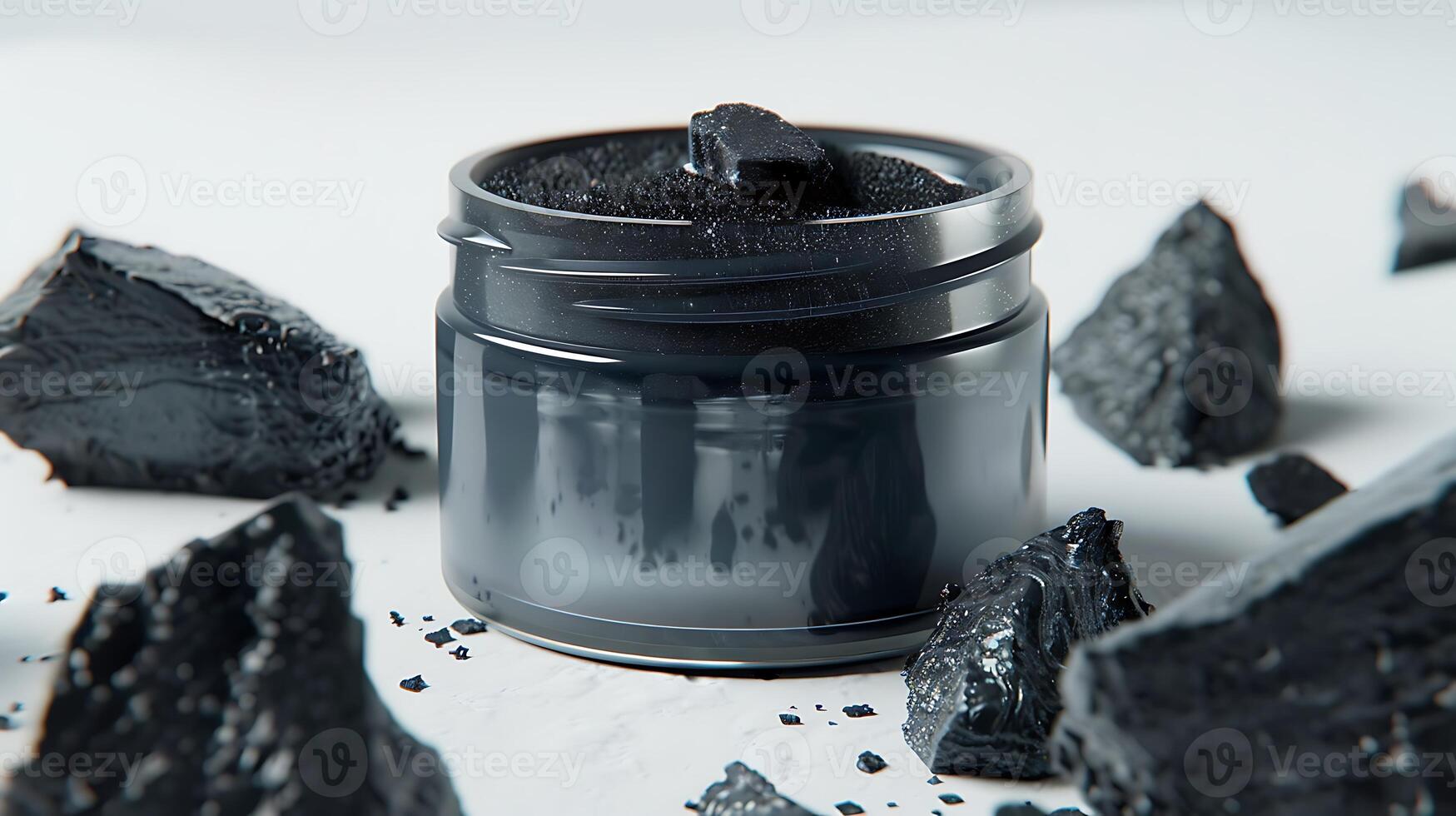 charcoal face lotion in jar with activated charcoal displayed on white background photo