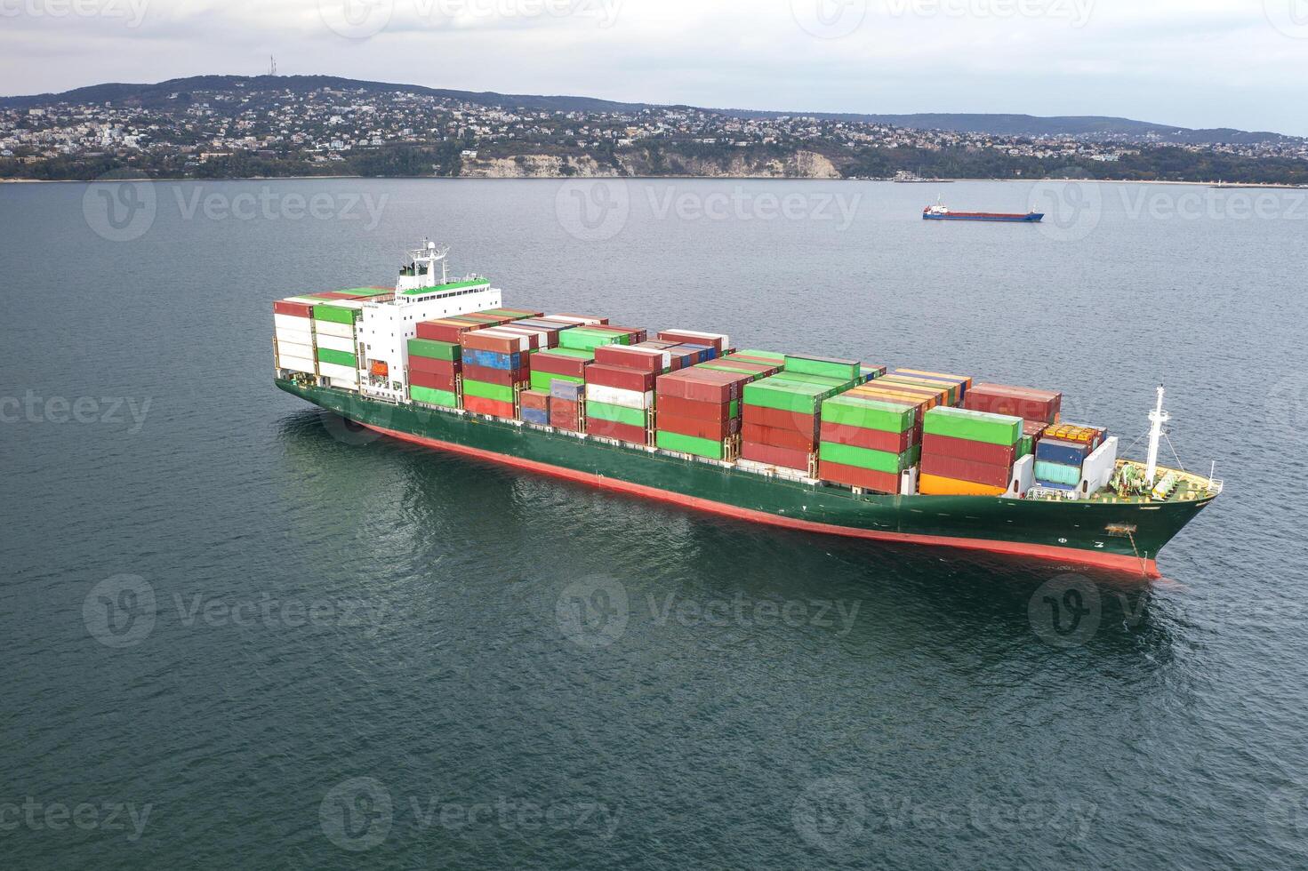 Aerial view of a container cargo ship on the sea. Cargo and shipping logistics businessAerial view of a container cargo ship on the sea. Cargo and shipping logistics business photo