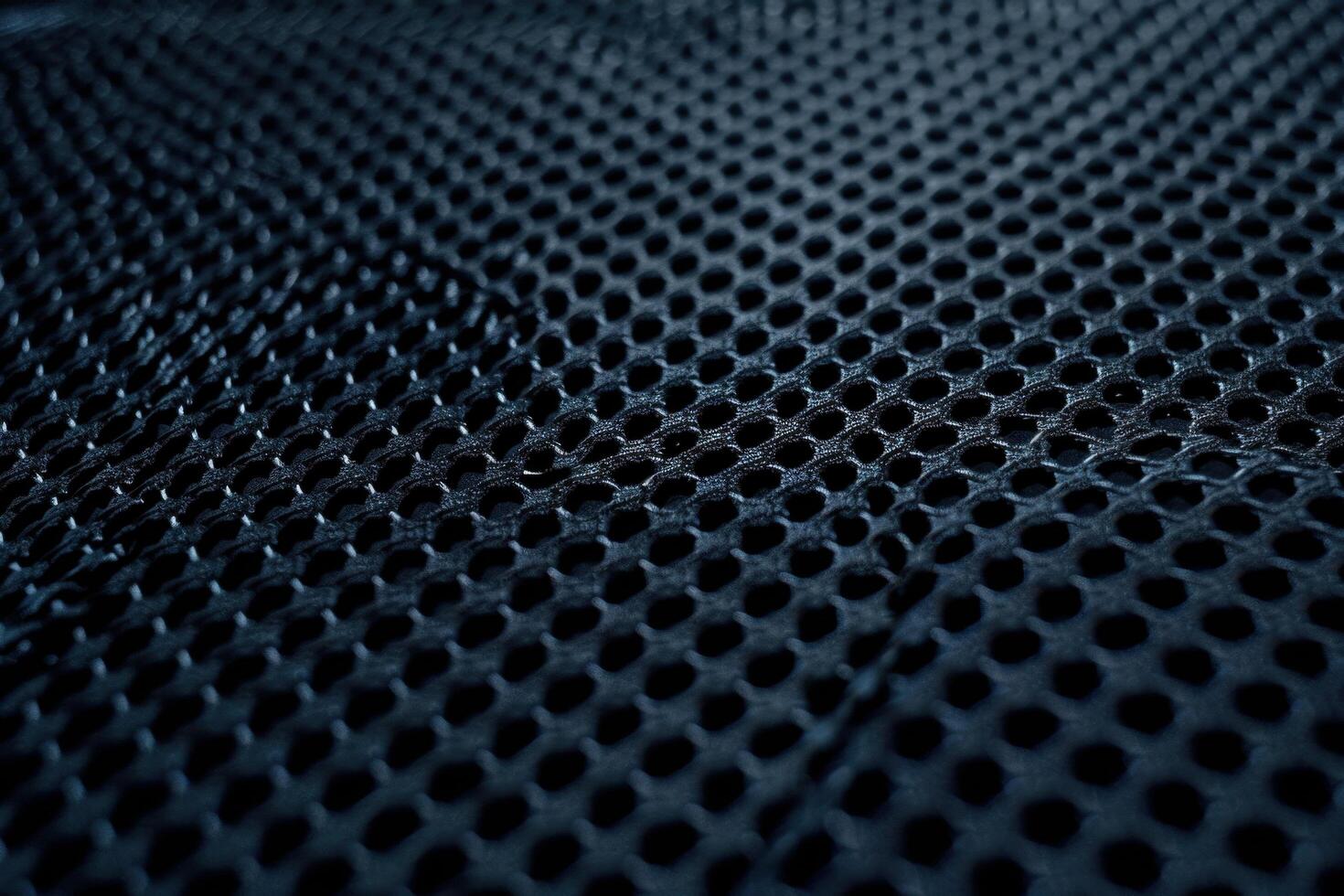 A dark blue mesh texture background featuring an intricate grid pattern photo