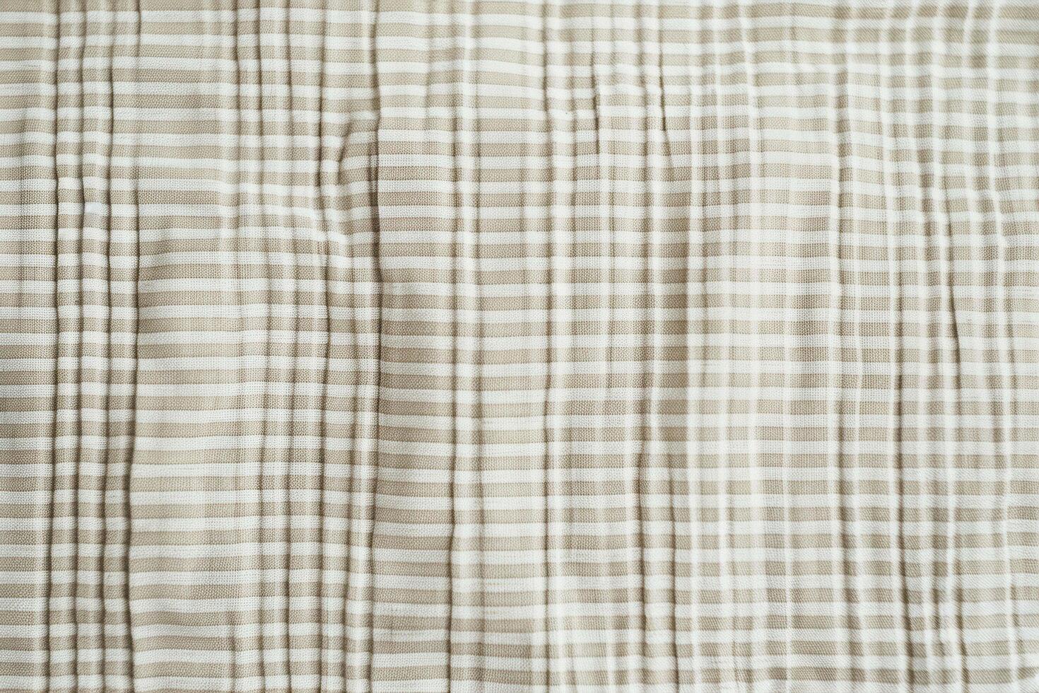 A seersucker texture background features alternating smooth and puckered stripes photo