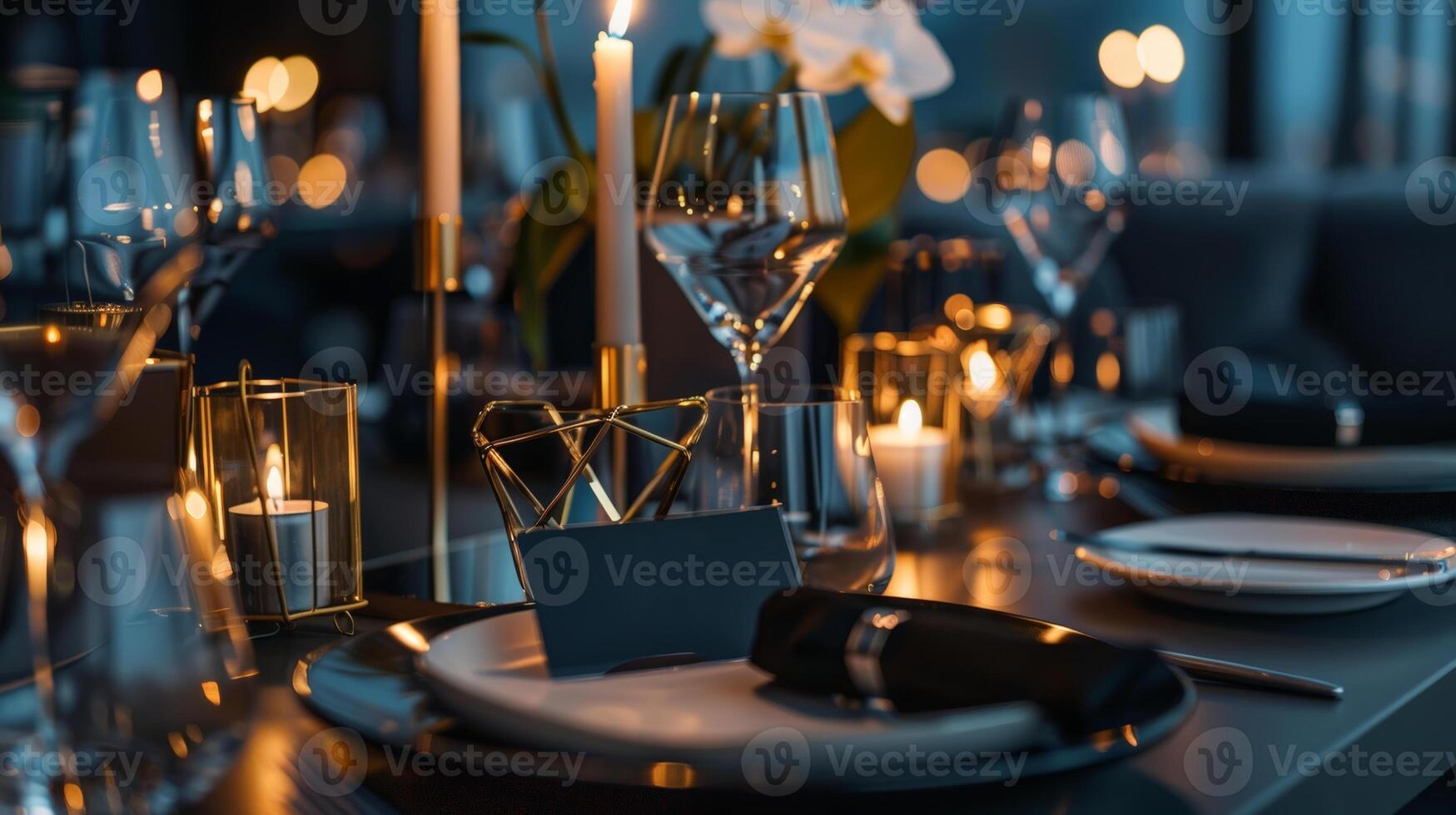 A beautifully arranged dinner table features sparkling glassware, flickering candles, and delicate flowers, creating an intimate ambiance perfect for a special occasion photo