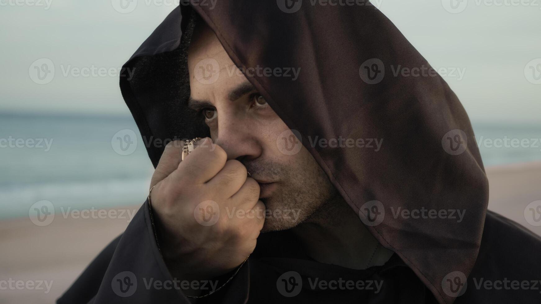 Religious Monk Kisses The Rosary In Symbol Of Faith Towards Christ photo