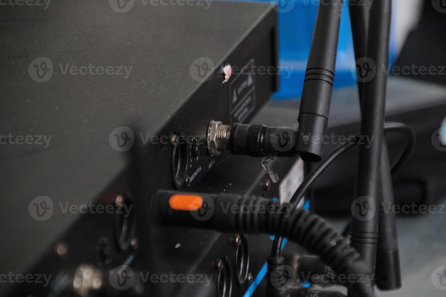 Rear view of the audio mixer machine being connected. photo