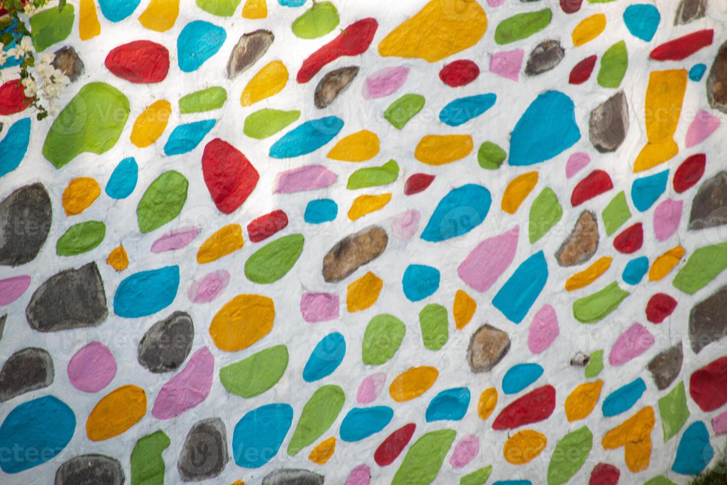 Texture of colorful painted stone wall photo