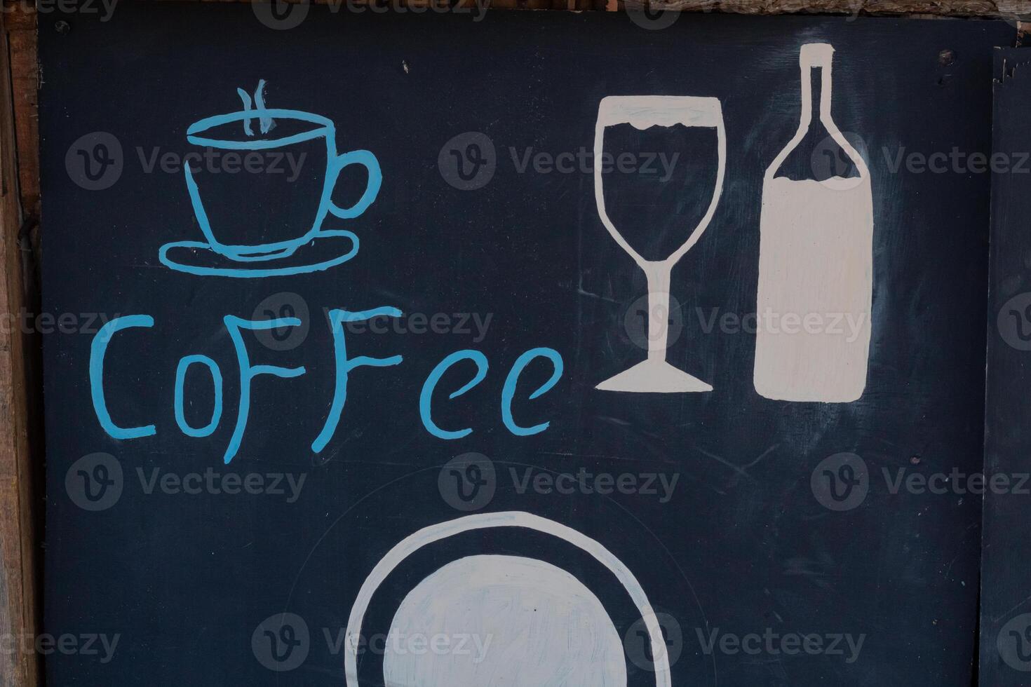 Coffee menu on blackboard outside coffee shop photo