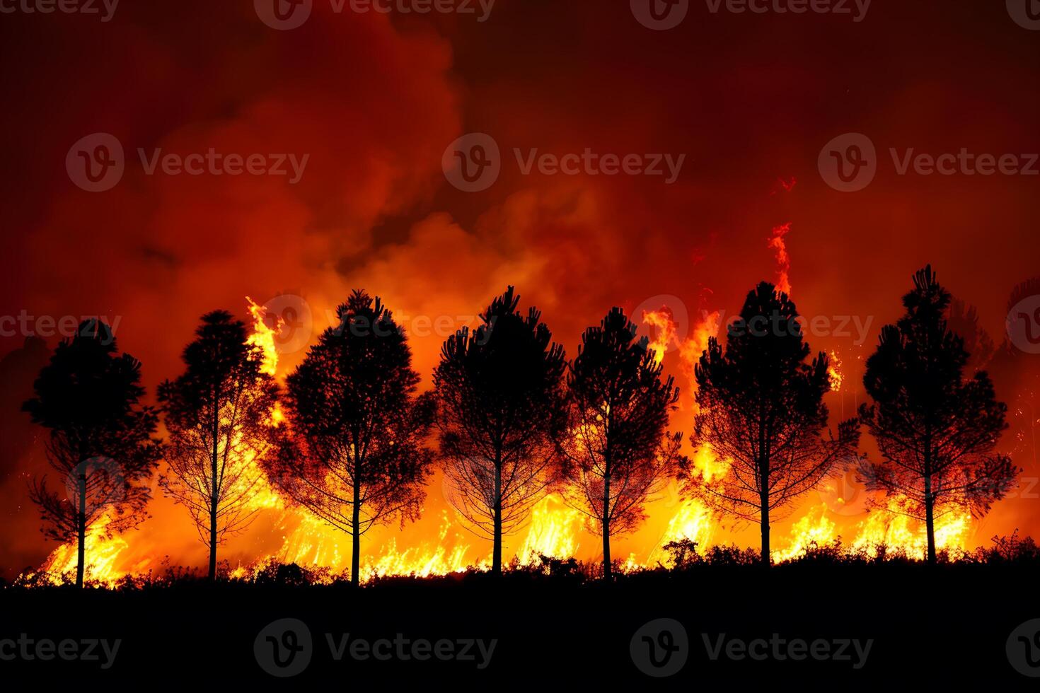 Forest Wildfire Inferno at Night with Tall Trees Silhouetted Against Massive Flames - Environmental Crisis Concept photo