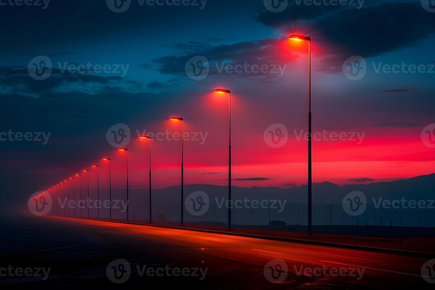 Scenic Twilight Highway with Row of Lamp Posts Against Red and Blue Sky for Print, Poster, and Digital Use photo
