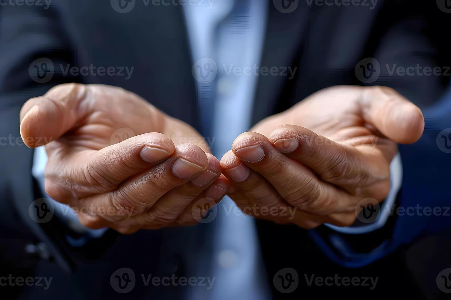 Close-Up of Businessman Offering Hands Concept of Assistance, Trust, and Support photo