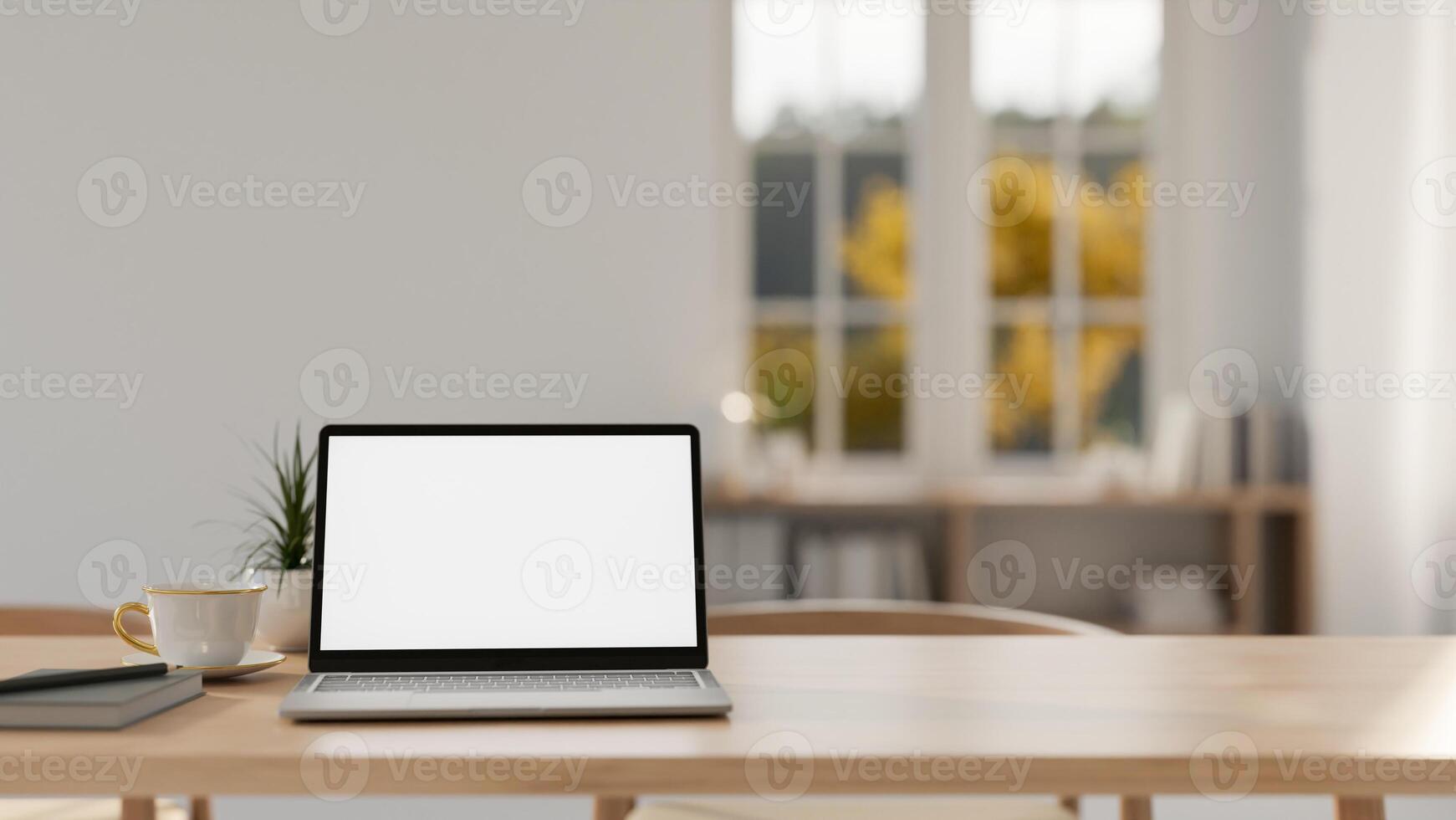 A laptop with a white screen mockup on a wooden tabletop in a contemporary minimalist room. photo
