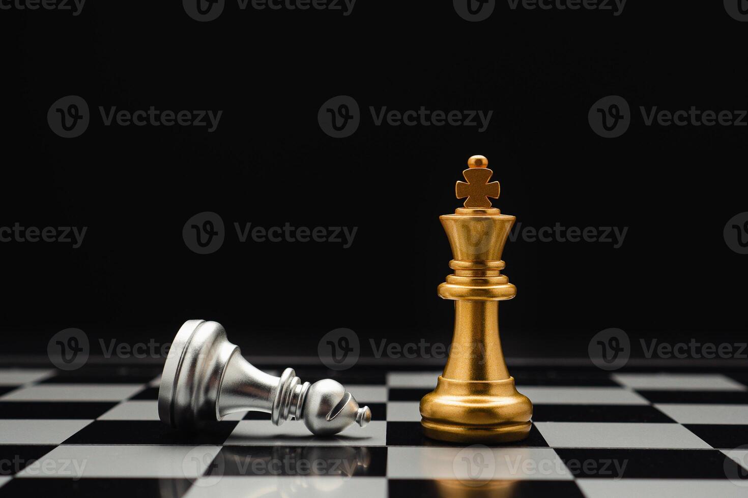 Chess pieces on board game planning and competition on black background photo