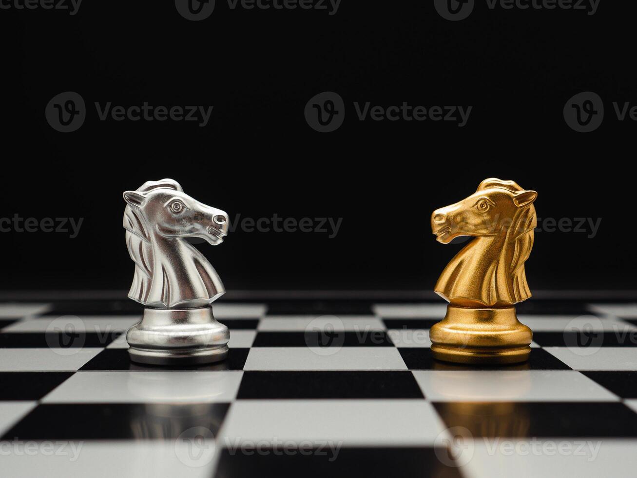 Chess pieces on board game planning and competition on black background photo