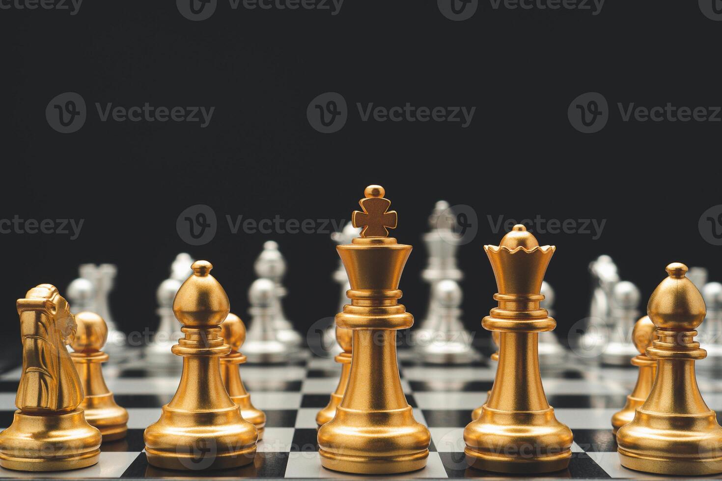 Chess pieces on board game on black background. Business and strategy concept photo