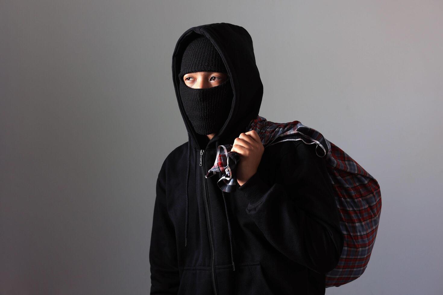 Thief with Bag of Money after Robbery photo