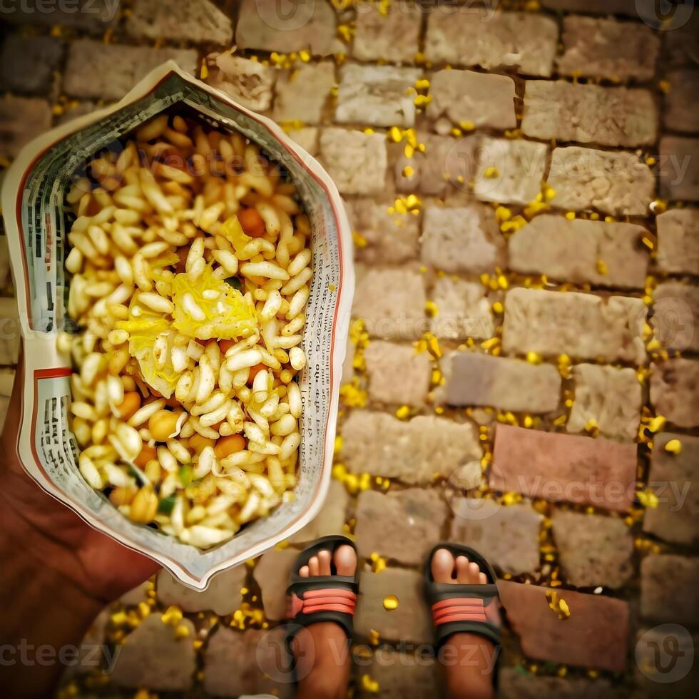 Indian snacks jhalmuri holding in hand photo