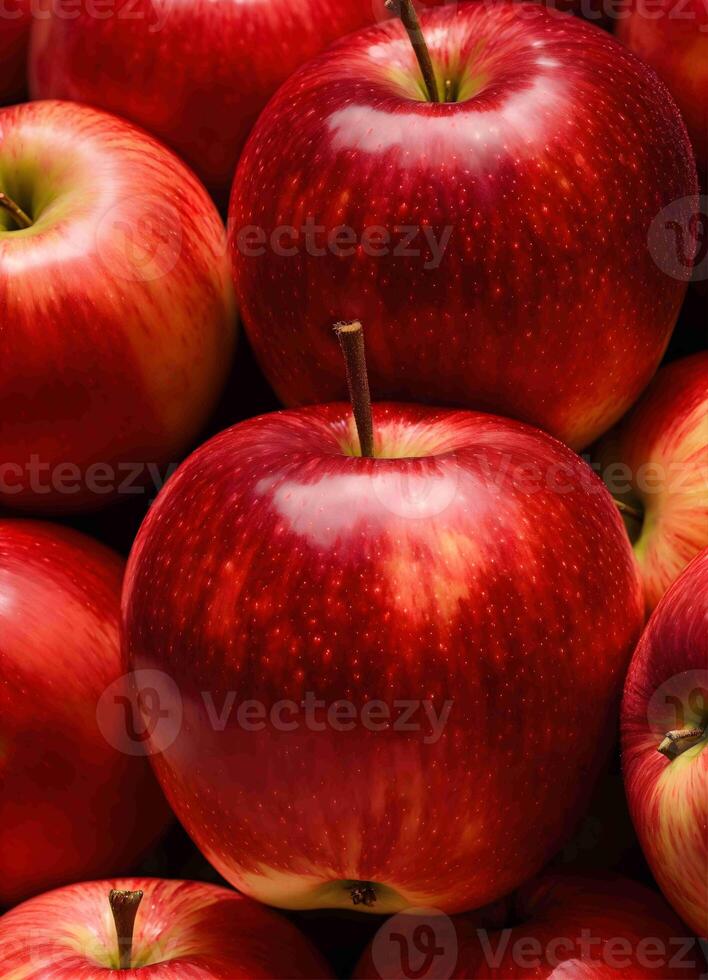 a pile of red apples with a green stem photo