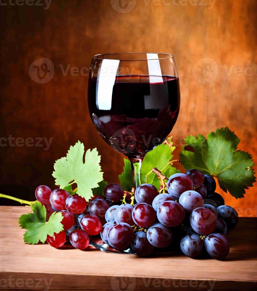 a glass of red wine and some grapes photo