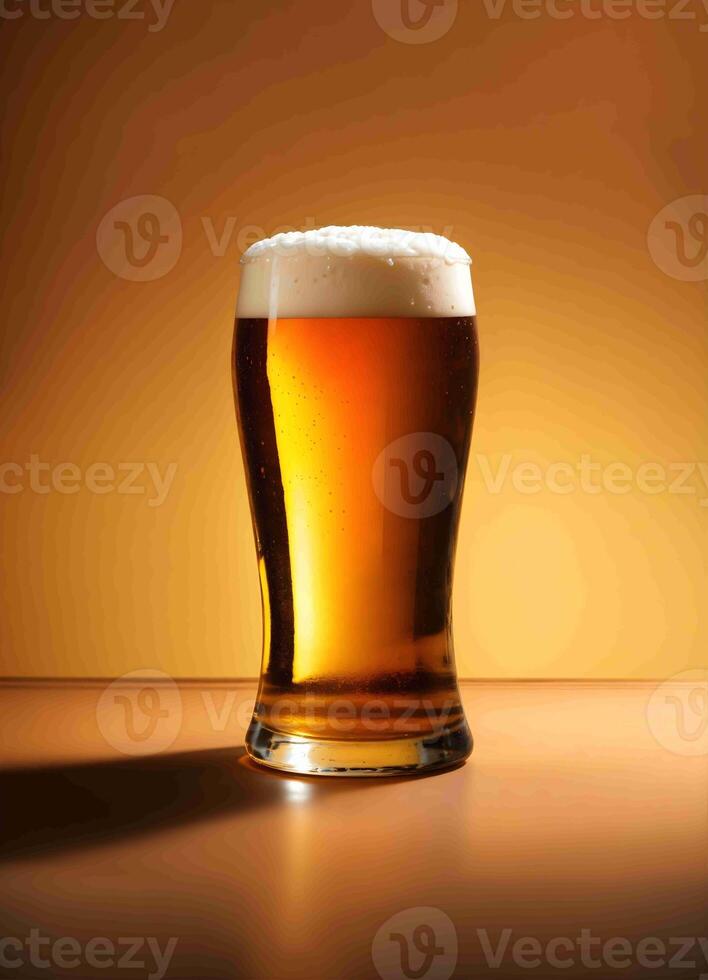 A glass of beer on a table with a golden background photo