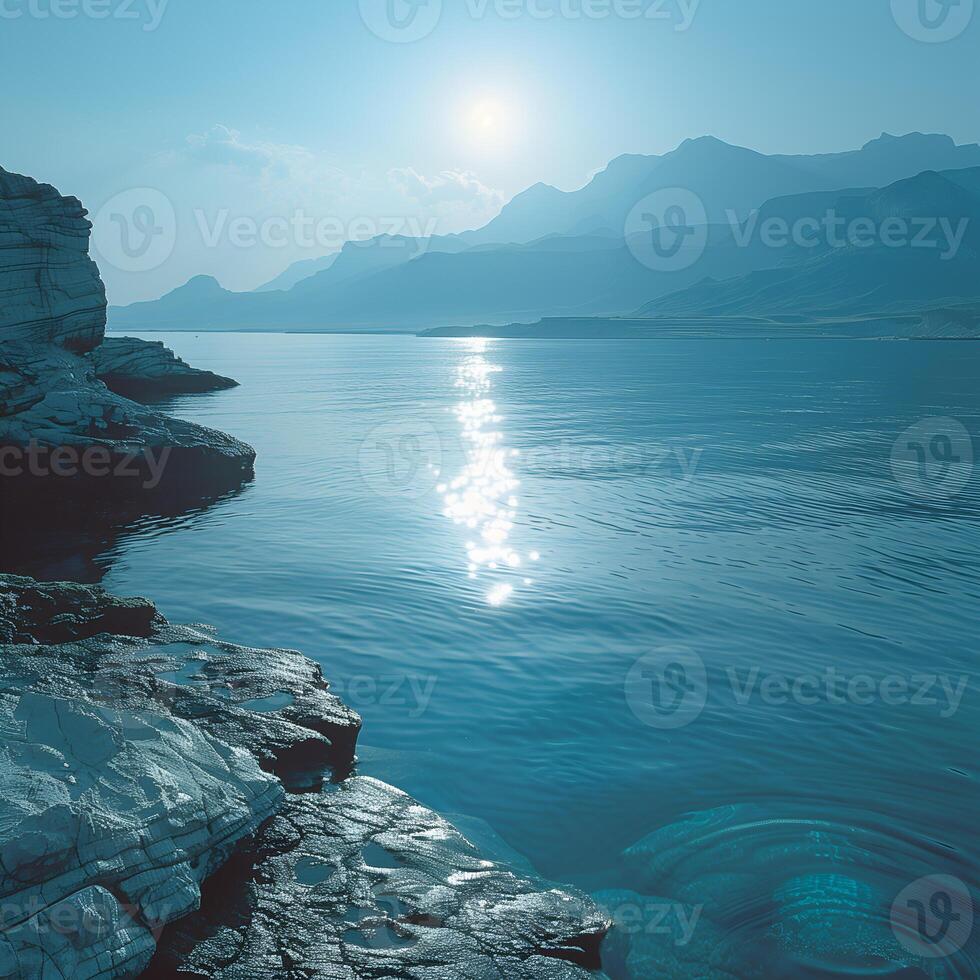 A large body of water with rocks and water photo